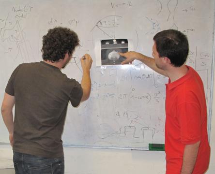 students writing on the whiteboard