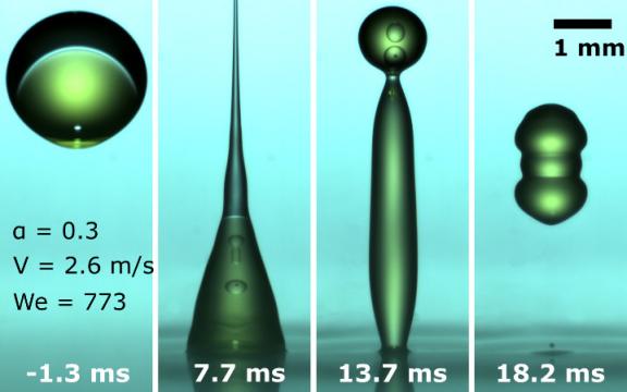 impatto di una goccia d'acqua in olio su una superficie